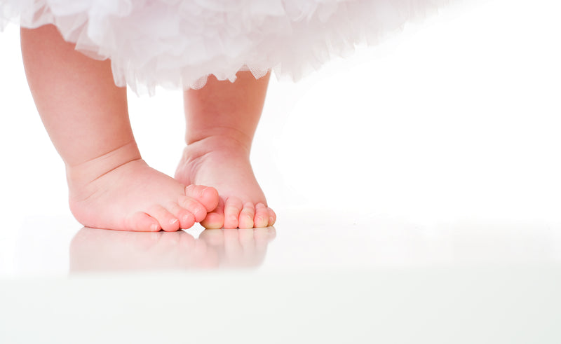 Cute baby going barefoot